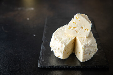 brynza or suluguni pickled cheese provolone meal snack on the table copy space food background rustic. top view keto or paleo diet vegetarian food