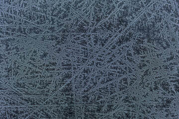 Winter background, frost on the metal. Matte texture. Place for text