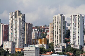 very high skyscrapers, blocks by the sea, the coast of the Croatian city of Rijeka, buildings of Rijeka, colorful buildings, windows with shutters