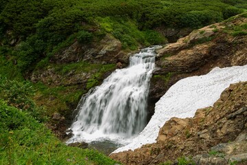 Fototapeta na wymiar Waterfall in Vatchkazhets valley (former volcano field), Kamchatka, Russia