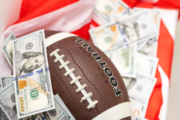 rugby ball and dollars on american flag