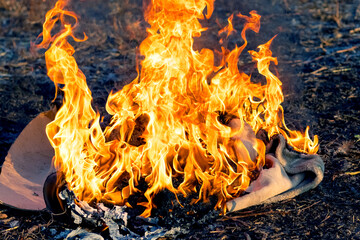 Burning old clothes after an infectious disease