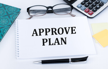text showing APPROVE PLAN on notepad. Business concept for Education.