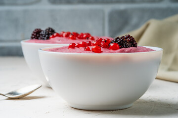 Bowl with semolina pudding with berries, close-up.