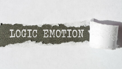 the text Logic Emotion appearing behind torn white paper, gray background