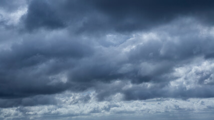 Fototapeta premium Dark storm clouds make the sky in black. Rain is coming soon. Nature background.