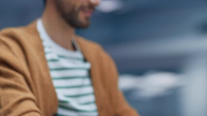 360 Degree Modern Office: Portrait Businessman Sitting at His Desk Working on a Laptop Computer. Man working with Big Digital Data e-Commerce. Tracking Shot From Hands to Face. Camera Moving Around