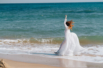 Fototapeta na wymiar pretty woman white dress walk beach freedom Lifestyle