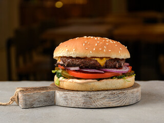 burger on a board in a restaurant