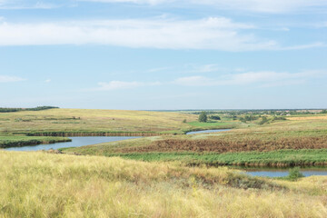 countryside landscape fields in summer with yellow dry grass august ukraine