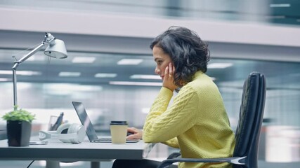 360 Degree Time-Lapse Office: Productive Latin Businesswoman Sitting at Her Desk Working on a Laptop Computer. Smiling Successful Hispanic Woman working. Energetic Moving Around Tracking Shot - Powered by Adobe