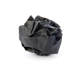 Black paper ball isolated on white background. Crumpled paper, closeup view