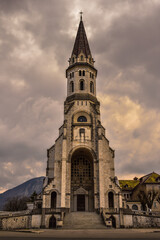 Fototapeta na wymiar Church in Annecy, France, called Basilique de la Visitation with a dramatic sky. Symmetrical photograph. 