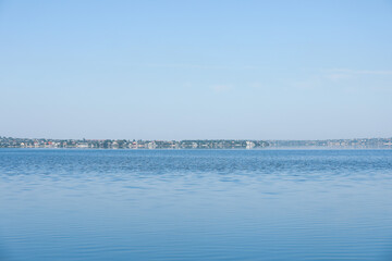 Picturesque view of calm river under blue sky