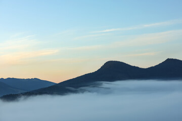 Beautiful mountain landscape with thick mist. Drone photography