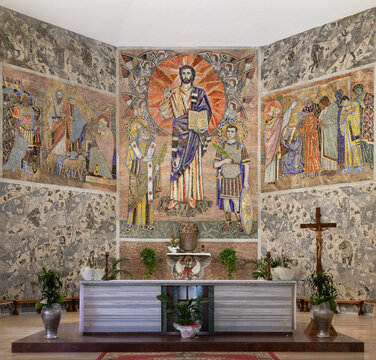 ROME, ITALY - SEPTEMBER 2, 2021: The modern mosaic of Jesus with the st. Fabian and Venanzio in the church Chiesa dei Santi Fabiano e Venanzioby P. Ugulino (1963 - 1964).