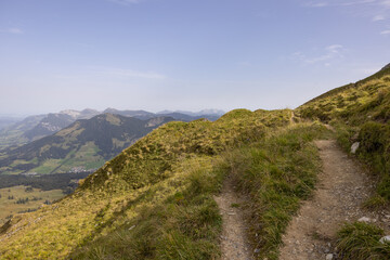 Fototapeta na wymiar Amazing hiking day in the alps of Switzerland. Wonderful view over a beautiful lake called Brienzersee. What an amazing view.