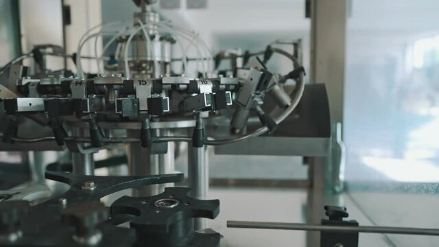 Automatic monoblock wine filling machine at wine factory.