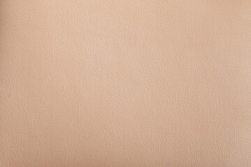 Fototapeta na wymiar Texture of genuine leather close-up, beyge brown color print. For your background, backdrop, with copy space