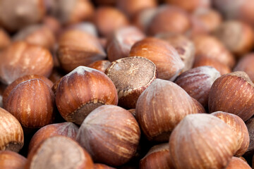 whole hazelnuts on a wooden table,in shell