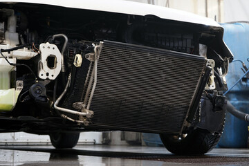 A radiator for cooling an engine of a modern car cleared of dirt. The cleaned radiator ensures...