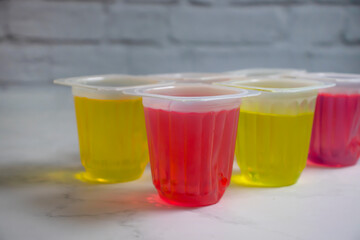 fruit jelly in a plastic glass