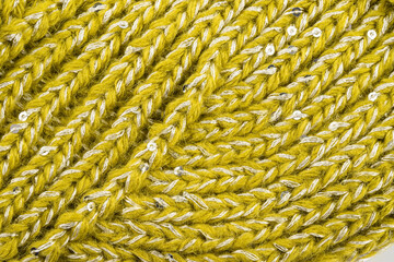 the product is made of woolen threads, connected by various types of loops on the spokes