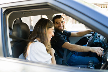 Happy woman and man on a road trip
