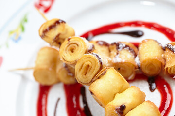 fried sweet rolls with sauce