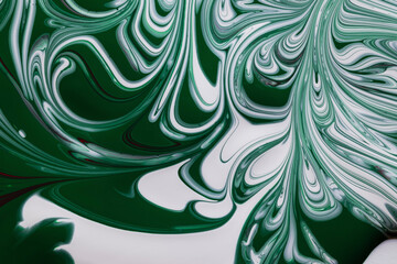 Elegant green and white paint swirls with a dash of red