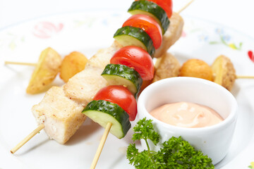 chicken kebab with potato and vegetables