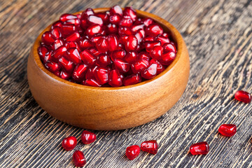 red ripe pomegranate seeds in a plate