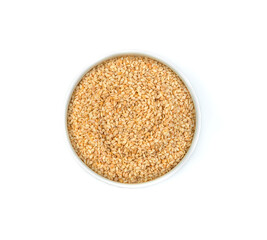 Sesame seeds in a ceramic bowl, isolated on white.