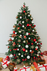 lights garland Christmas tree with gifts New Year 2022