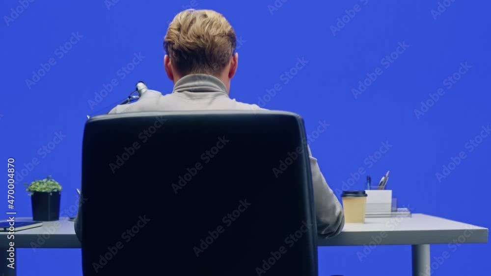 Aufkleber office green screen background: businessman sitting at his desk working on a laptop computer. man wo