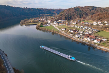 Fototapeta na wymiar Pusher Boat Transporting Cargo Along The River Danube