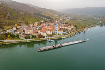 Fototapeta na wymiar Pusher Boat Transporting Cargo on a Foggy Day on the River Danube