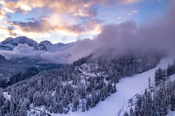 Fototapeta na wymiar Switzerland Winter Landscape Sunset With Snowy Mountains
