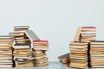 stacks of educational books in the college library on a white background