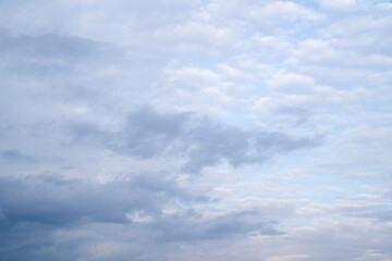 Background of beautiful fluffy gray-white clouds. Natural background.