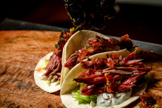 Chef Making Tacos With Smoked Beef And Vegetables