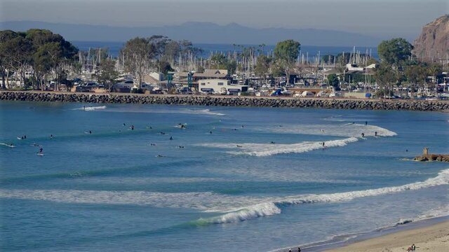 People surfing at Doheny Beach in Dana Point, California