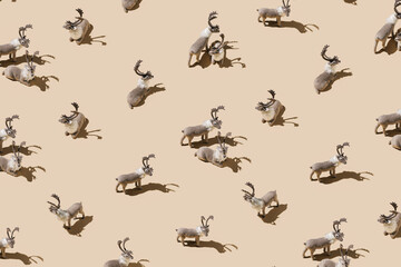 Pattern with elks isolated on a pastel beige background. Christmas and New Year celebration...
