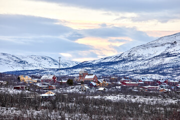 The village Abisko East in northern Sweden winter afternoon at sunset.  Frozen winter landscape in northern Sweden.
