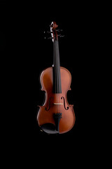 Fototapeta na wymiar A wooden violin or viola on a black background