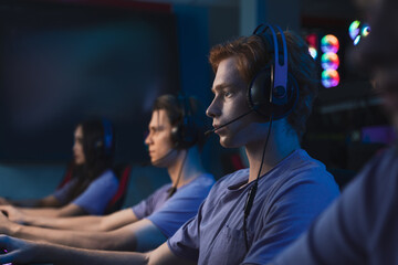 Concentrated pro gamer playing game, taking part in online tournament © Yakobchuk Olena