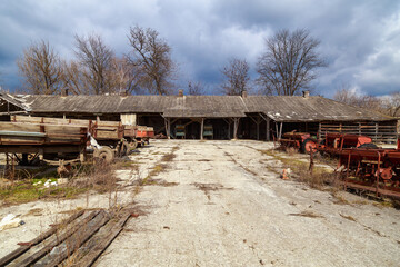 Devastation and decline in the agro-industrial sector. Cemetery of old rusty agricultural...