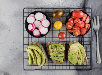  avocado toast with fresh vegetables  