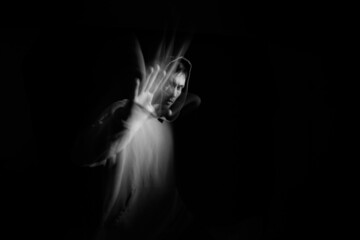 Fototapeta na wymiar Portrait blurred in the dark.Portrait in motion.