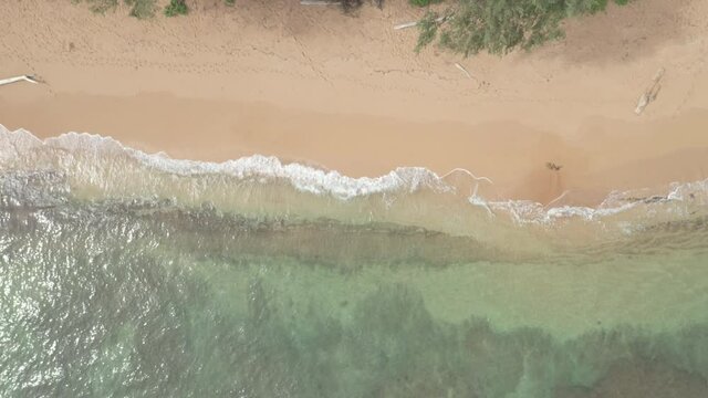 Aerial Birds Eye View of Surf on Beach Kauai Hawaii